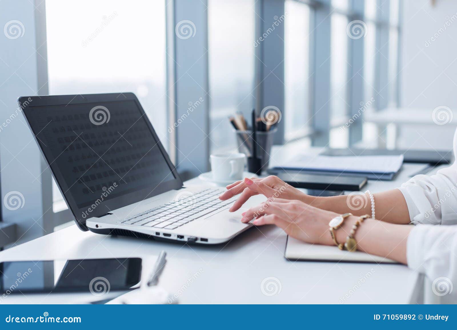 female worker using laptop in office, working with new project. woman blogging at home as a freelancer.