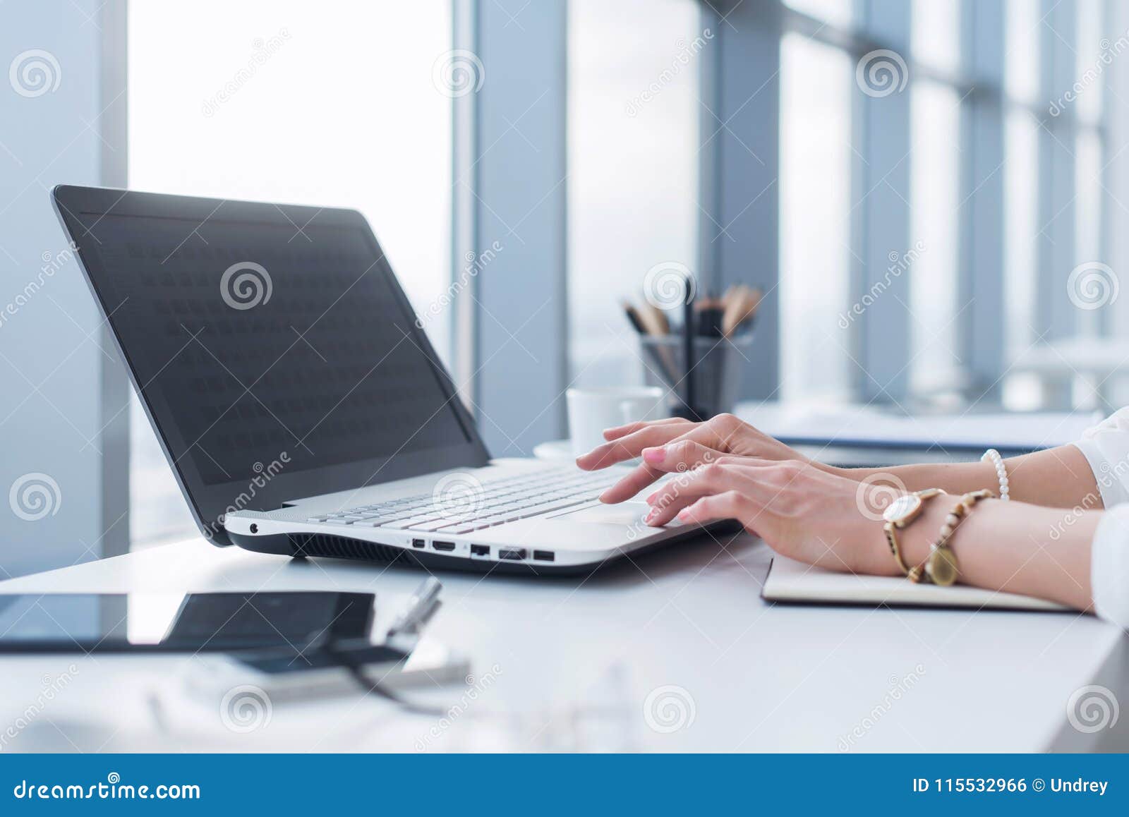 female worker using laptop in office, working with new project. woman blogging at home as a freelancer.