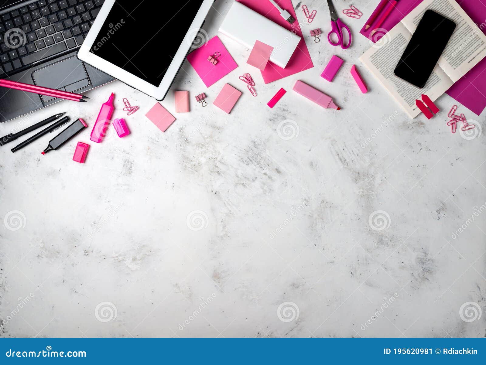 Female Workspace with Pink Office Accessories and Gadgets. Top View