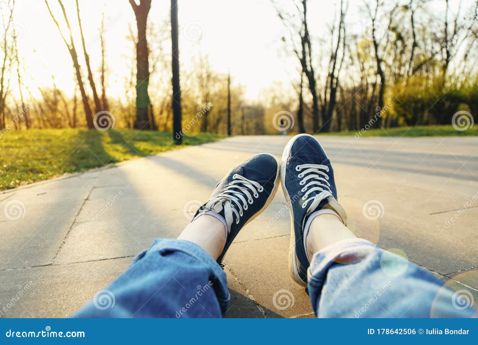 Females Legs with Sneaker Shoes on the Ground Stock Photo - Image of ...