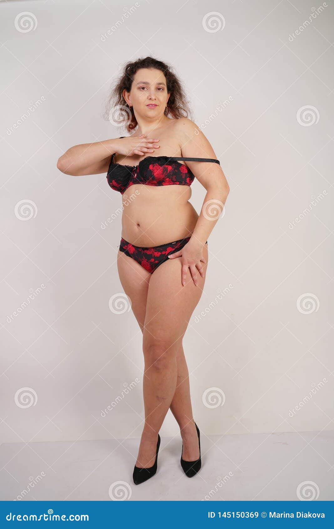 feminine-chubby-woman-plus-size-body-black-lingerie-posing-white-background-studio-isolated-145150369.jpg