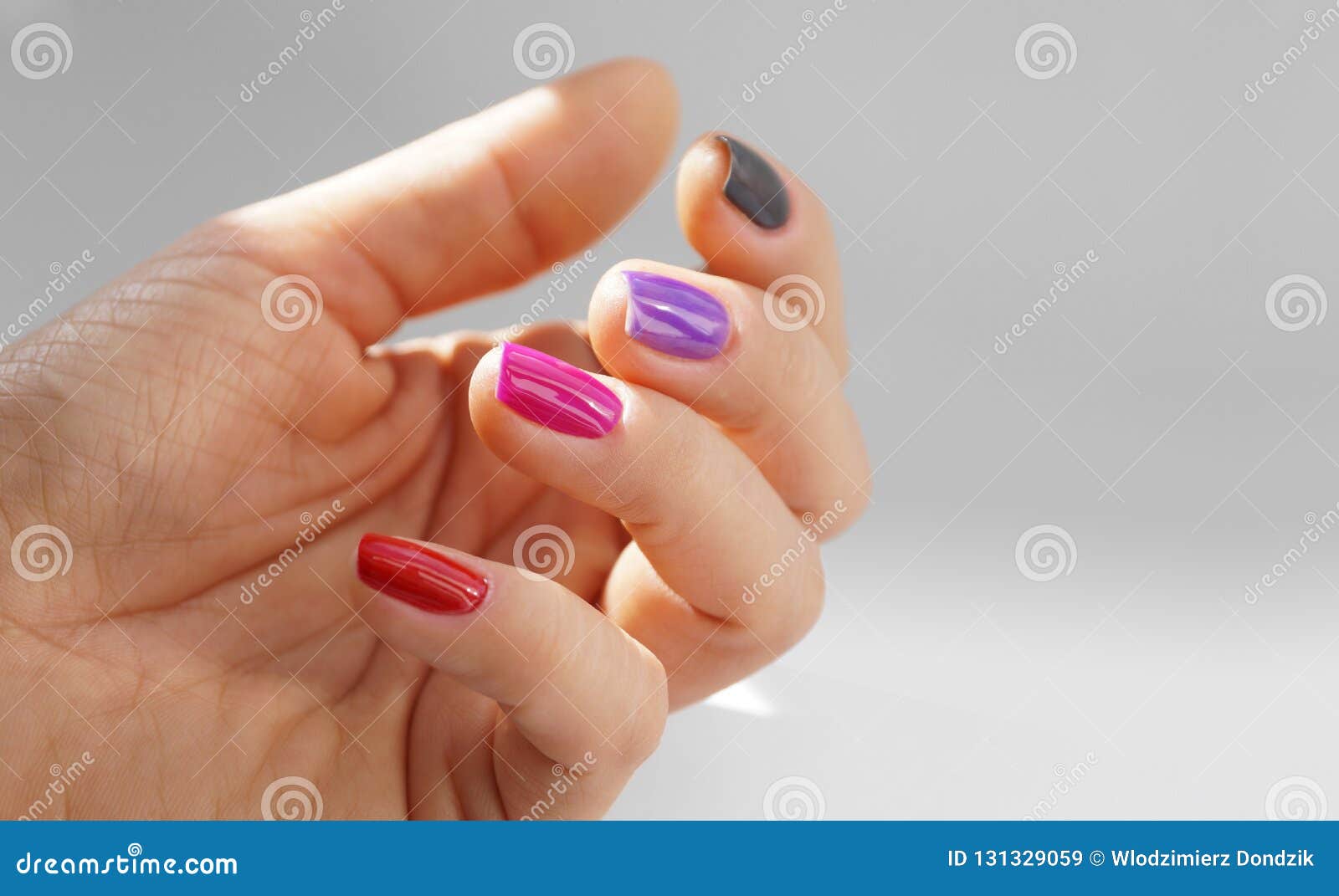Different Colors of Nail Polish. Feminine Hand with Painted Nails, Each ...