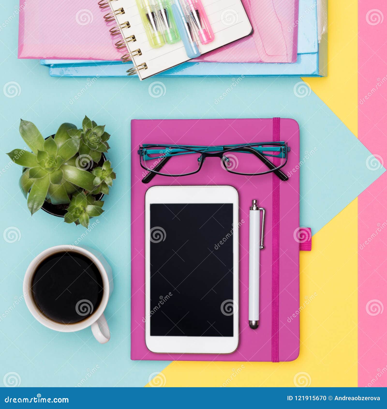 office desk working space flat lay. top view photo of workspace with smartphone, coffee, notepad and woman fashion magazines.