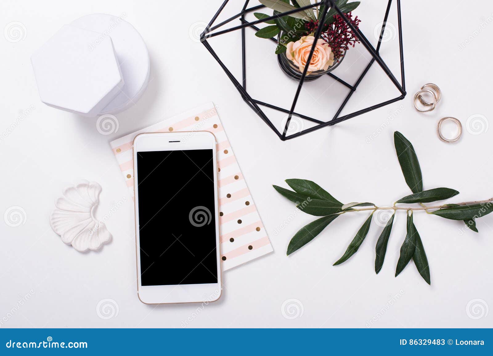 feminine tabletop flatlay with smartphone mock-up
