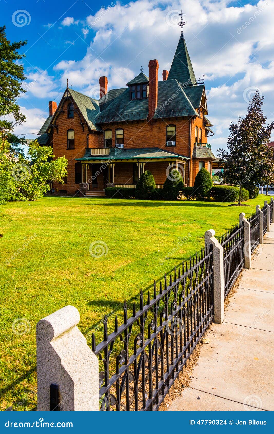Fence and Old House in Spring Grove, Pennsylvania. Stock Photo Image