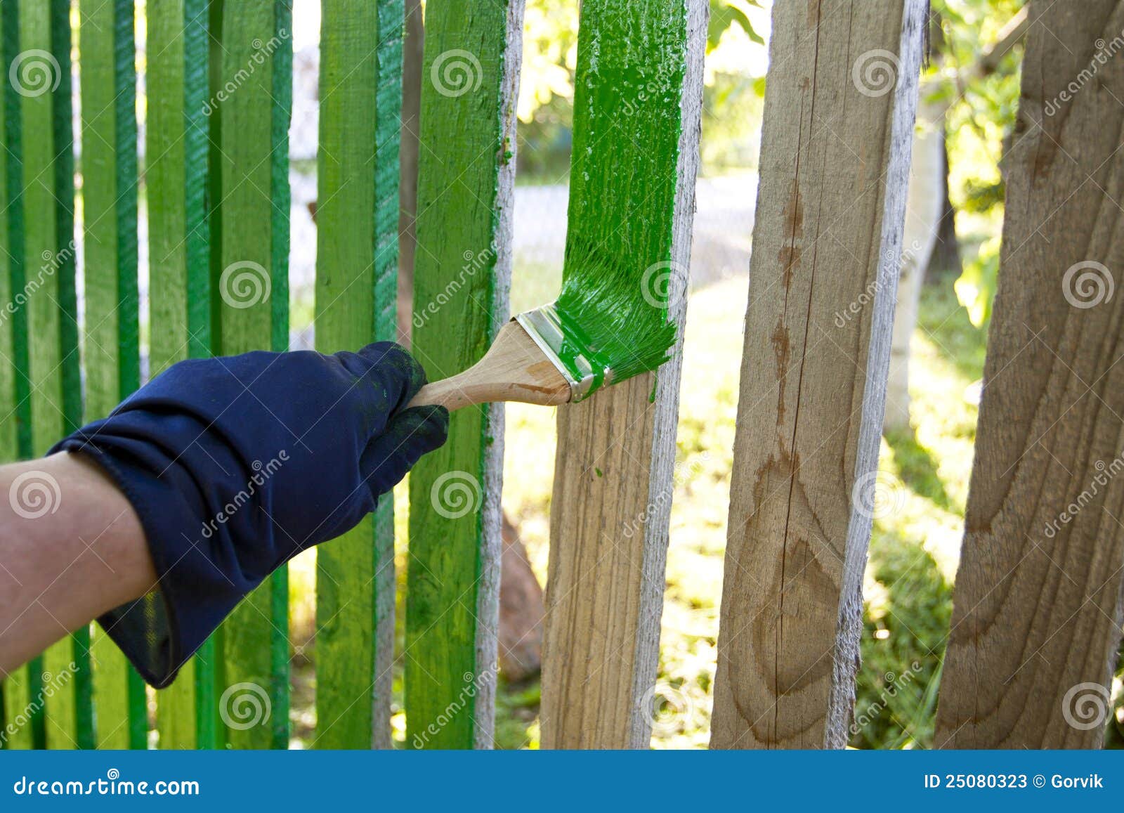 Fence painting by a brush stock image. Image of repair 25080323