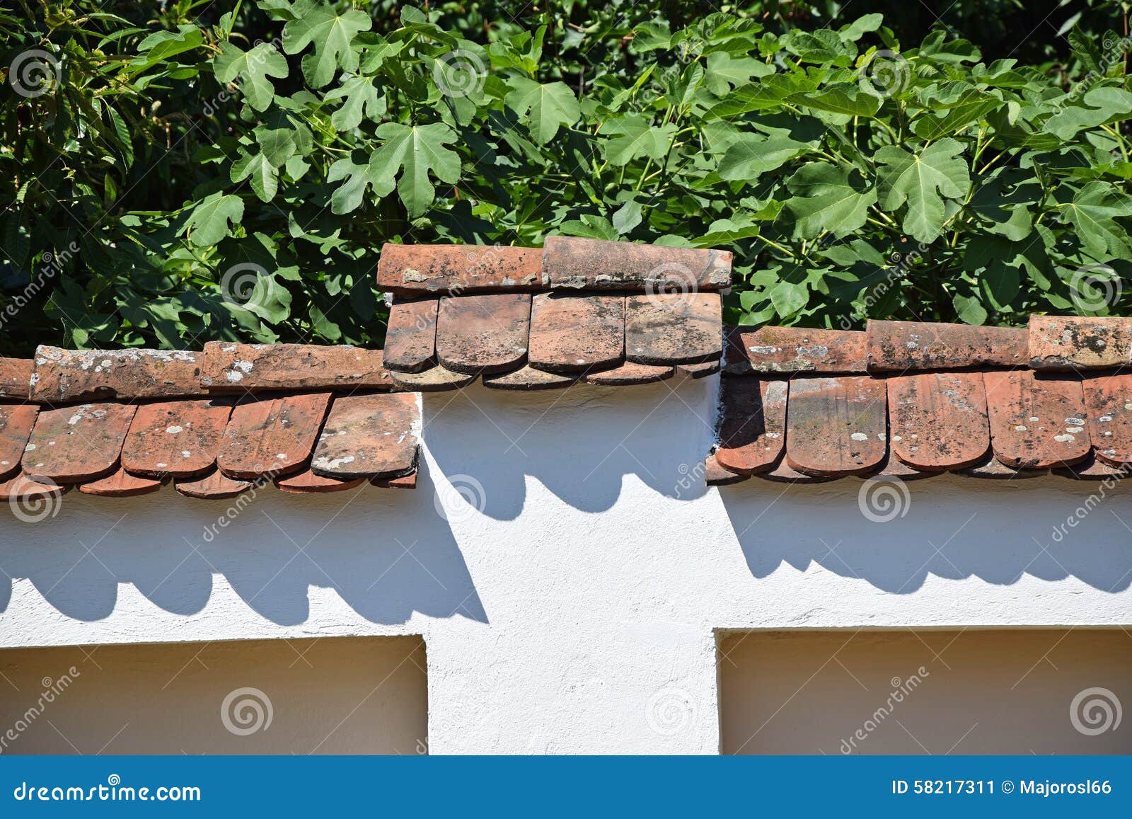 Fence with roof tiles stock image. Image of front, green 58217311