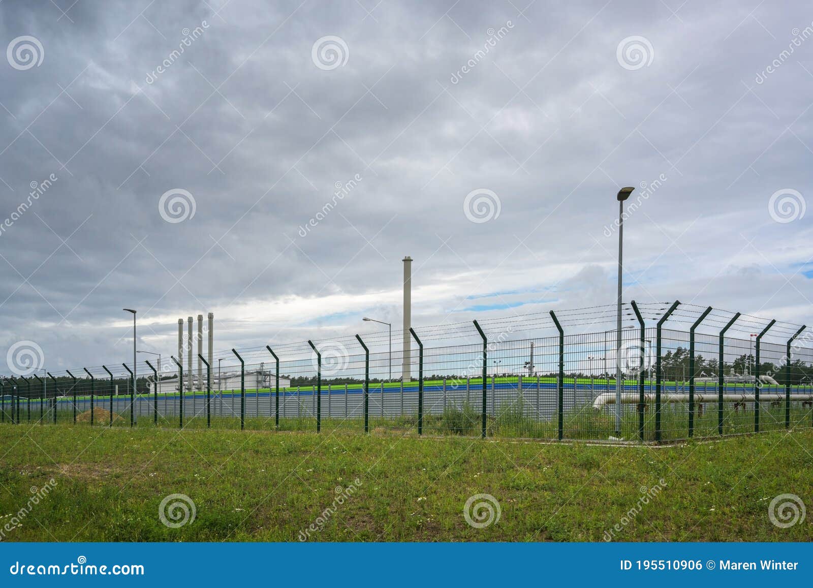 fenced landfall station of nord stream 2 in lubmin near greifswald under a cloudy sky, gas pipeline through the baltic sea from