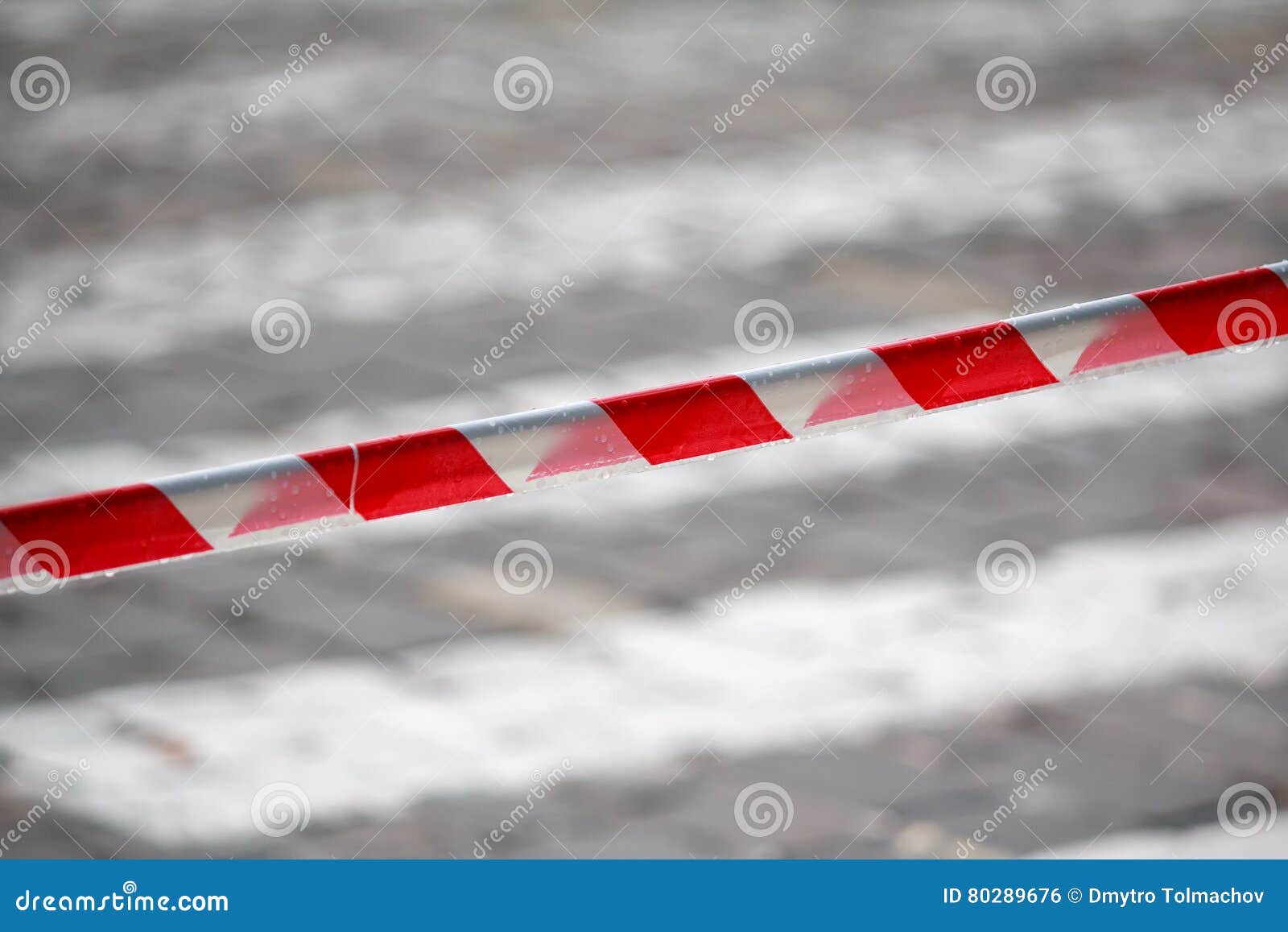 fencing red and white ribbon which prohibits movement