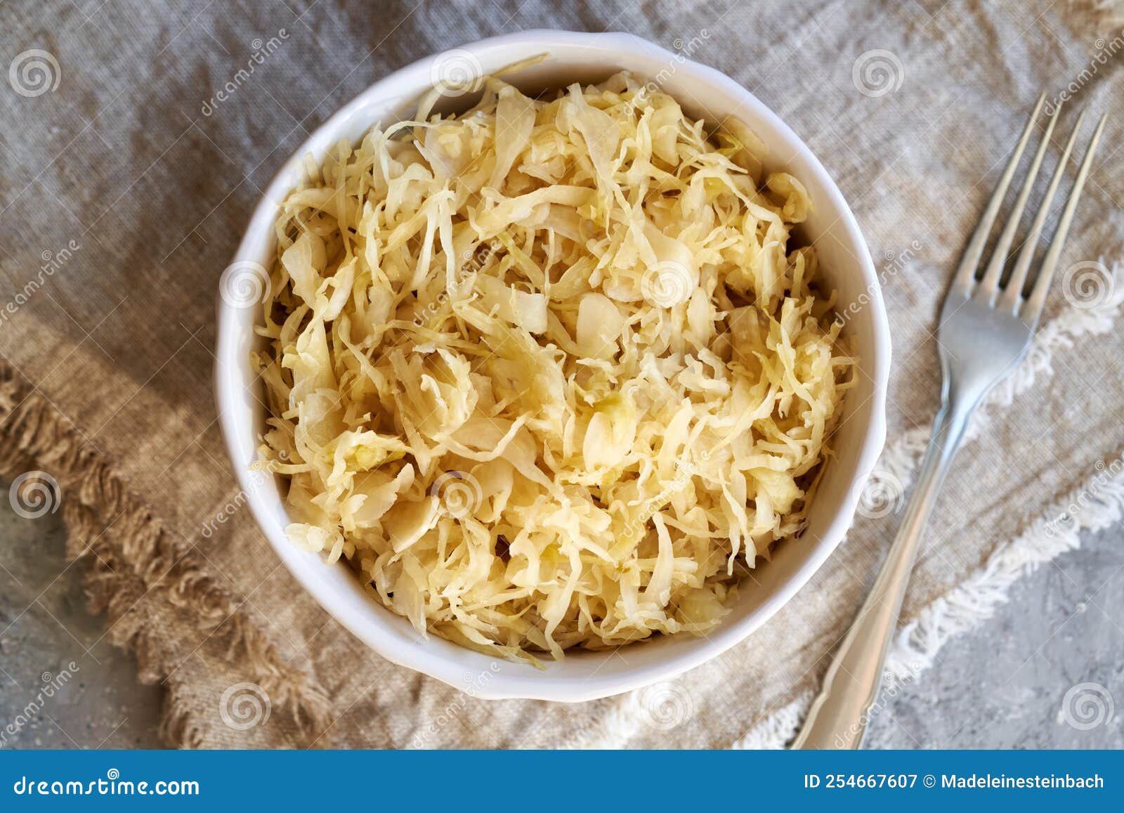 Fermented Cabbage or Sauerkraut in a Bowl with a Fork Stock Image