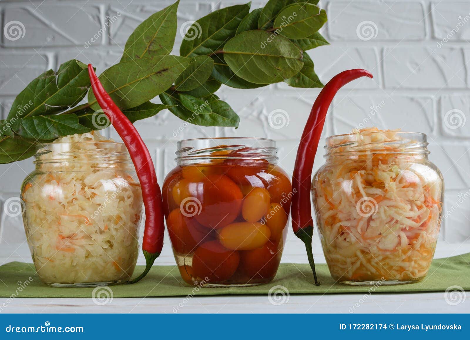 fermented foods. sauerkraut, salted tomatoes on a white background. vegetarian food