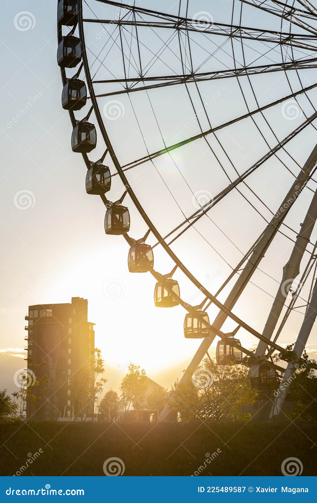 ferris wheel with the sunset behind