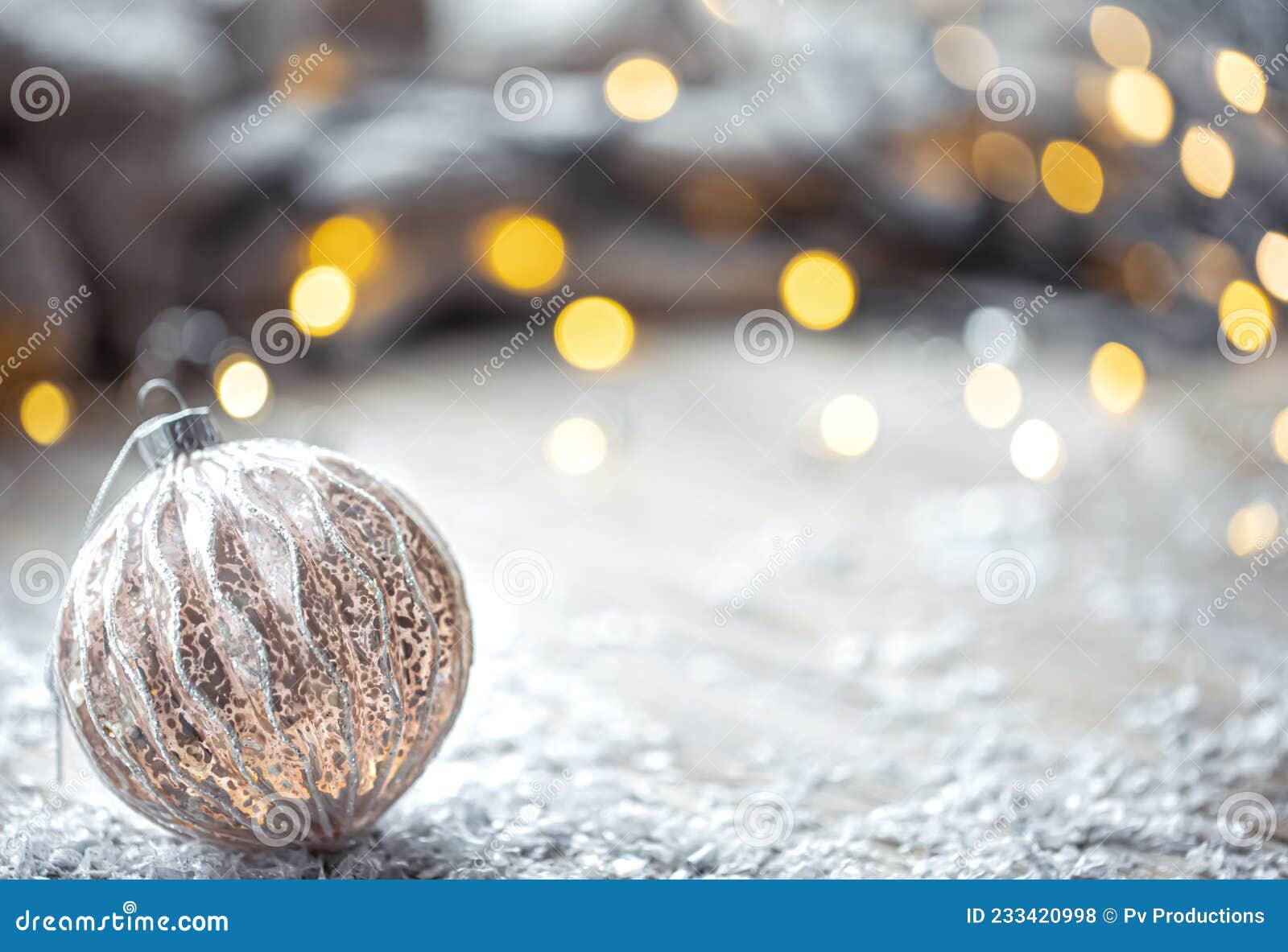 festive background with christmas ball and blurred bokeh lights, copy space.