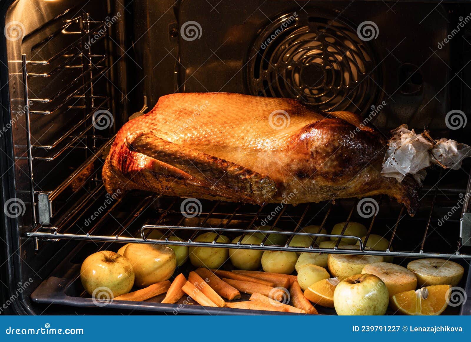 Festive Christmas Goose with Fried Vegetables and Fruit in the Oven