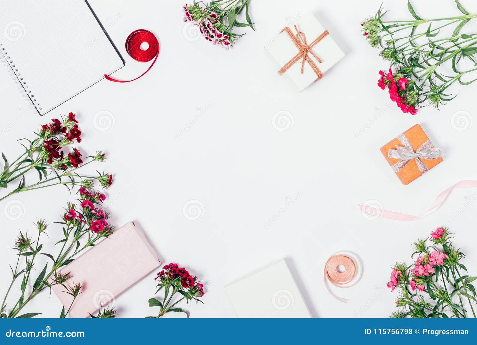Festive Composition of Gift Boxes with Ribbons and Flowers Stock Photo