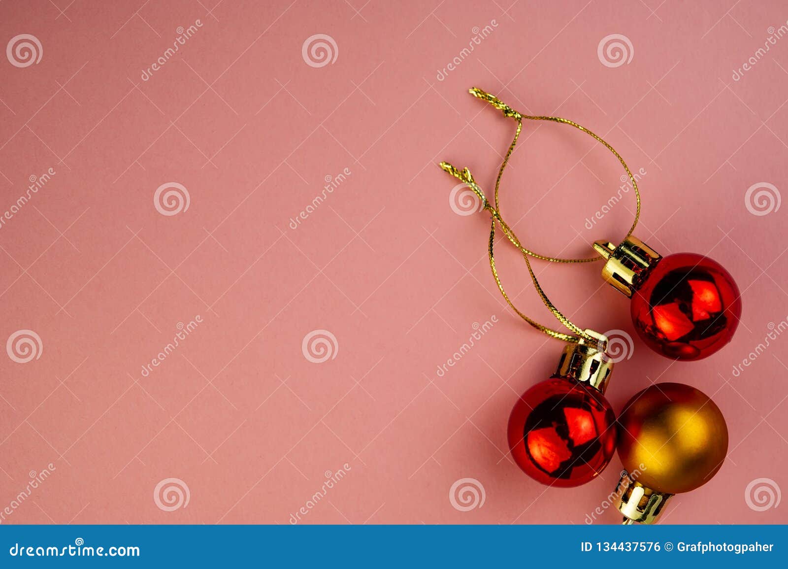 Festive Multicolored Decorative Balls on a Pink Background Stock Photo