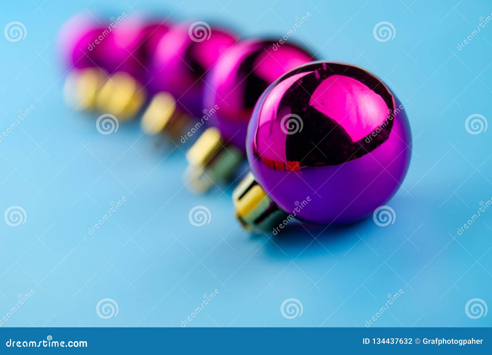 festive purple balls on a blue background