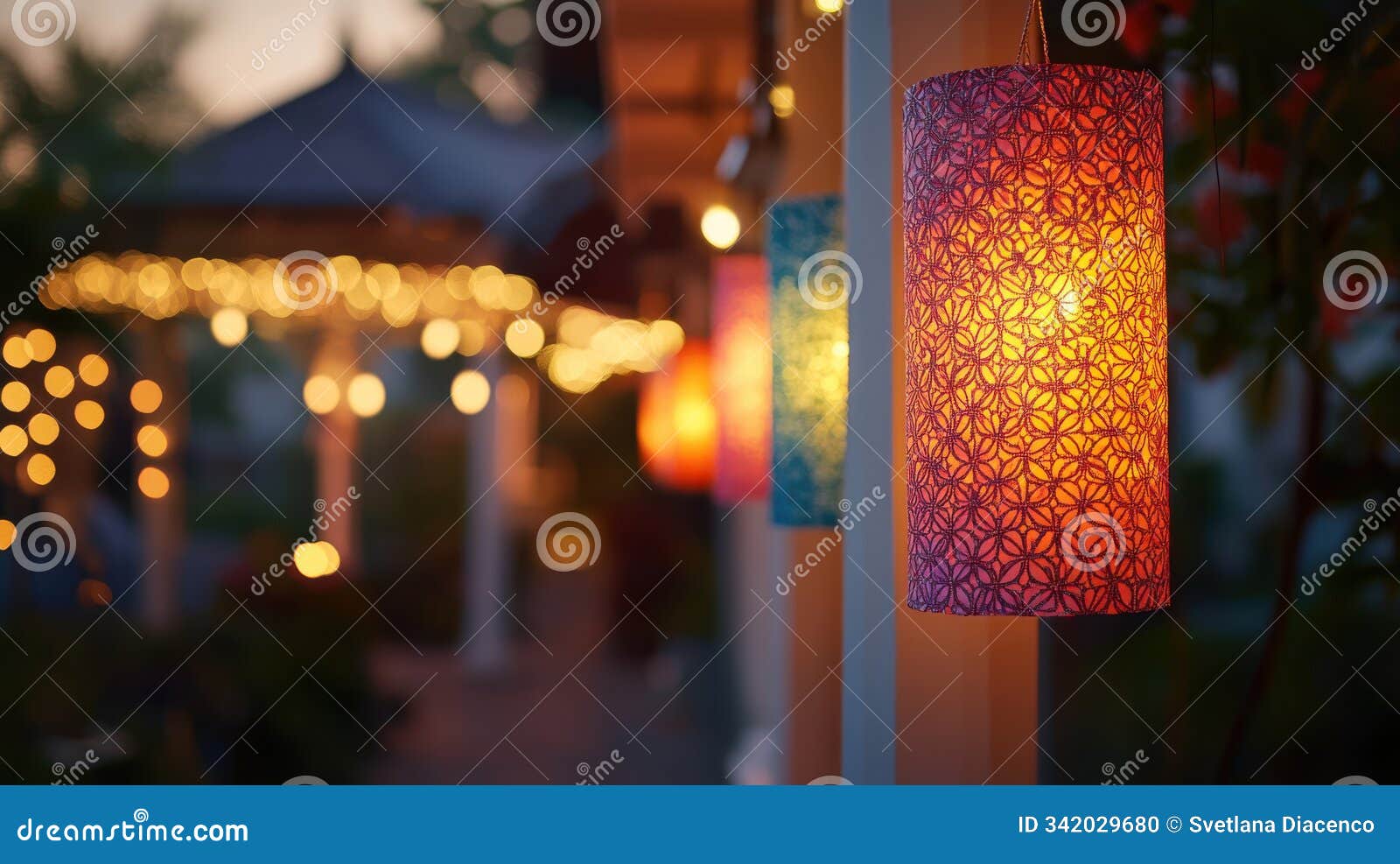 festive row of hanging diwali lanterns adorned with intricate patterns, glowing warmly in the evening with soft shadows