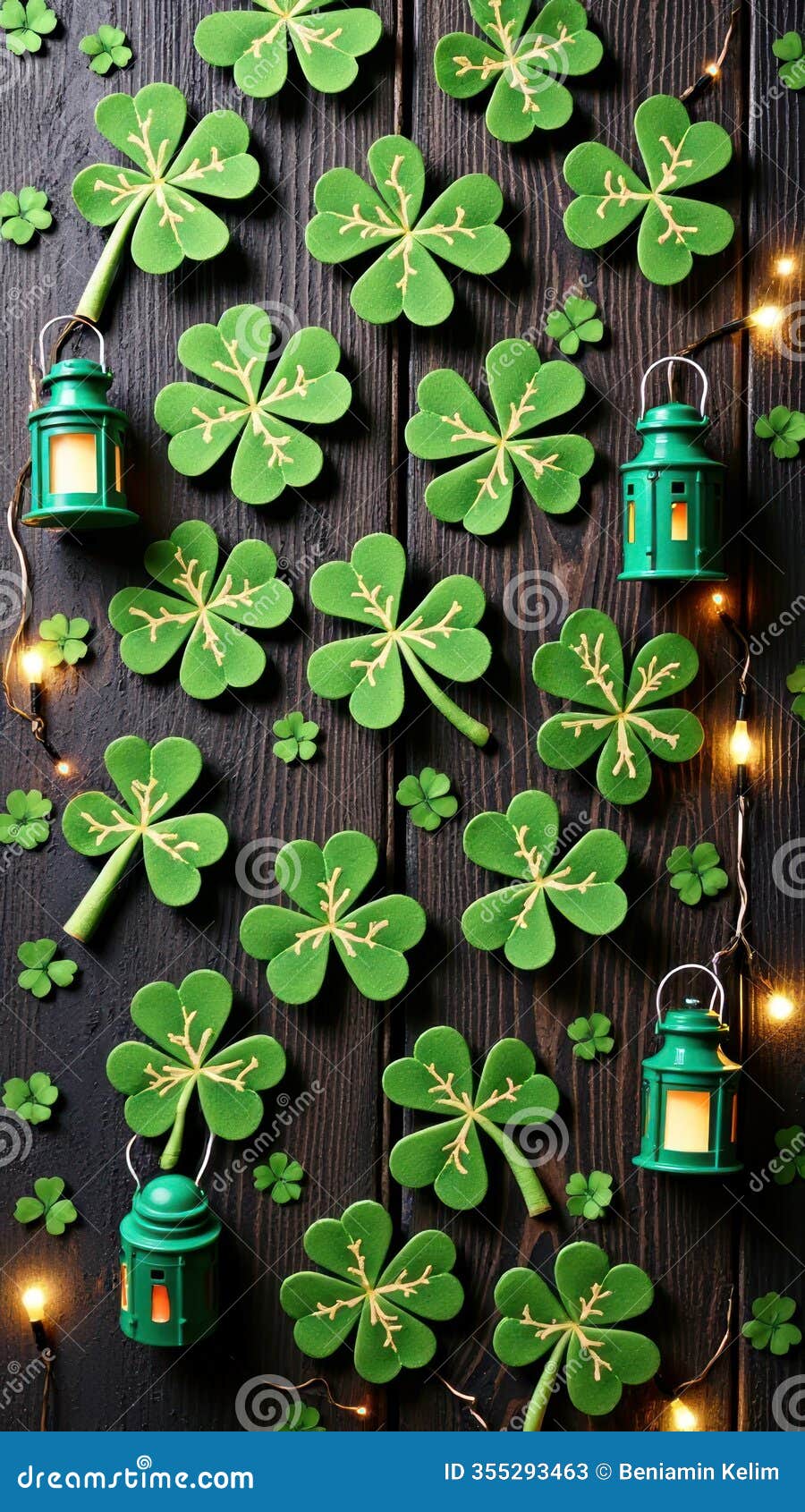 festive shamrock display with lanterns and fairy lights on wooden background