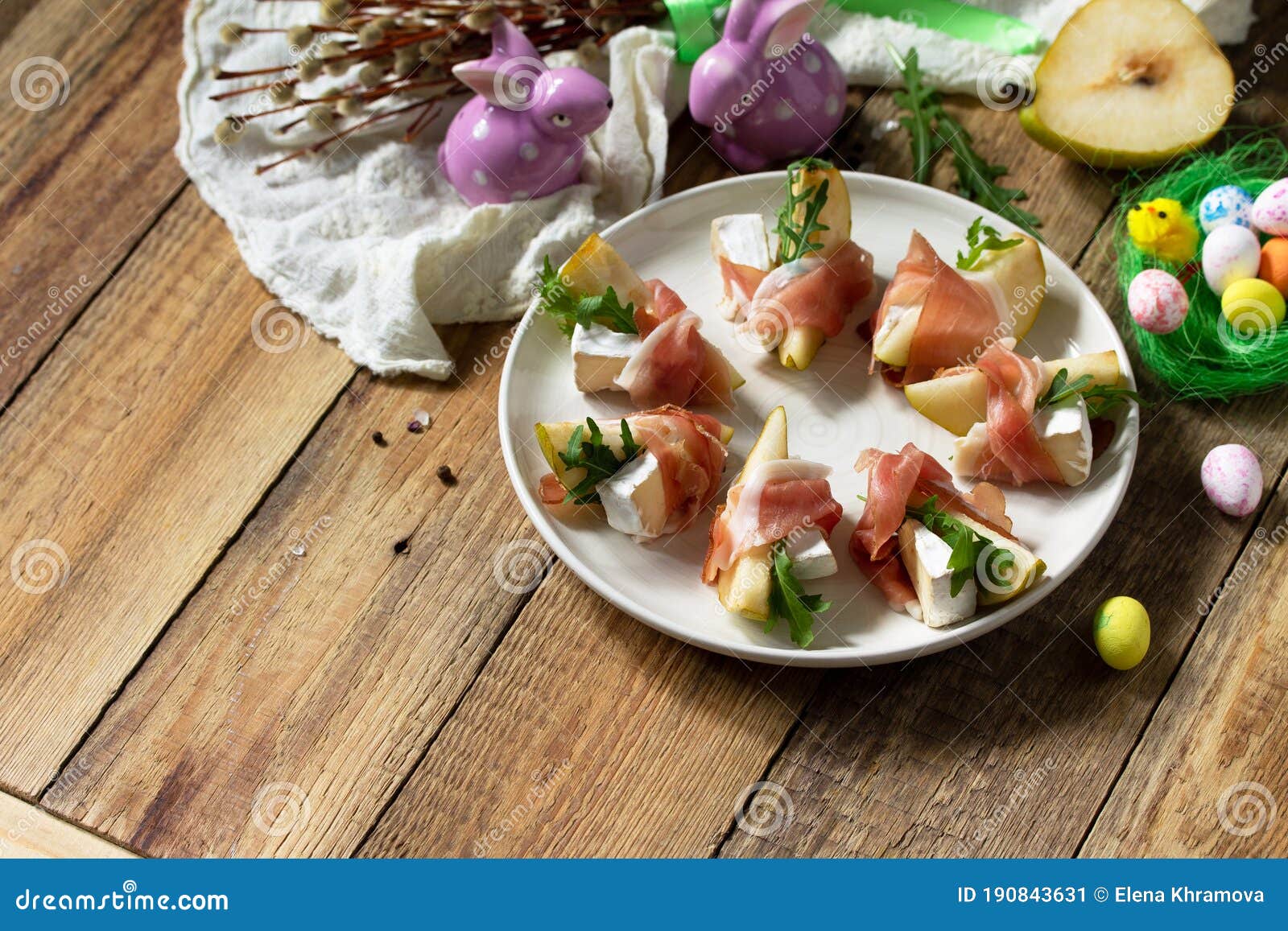 Festive Snacks. Pear Appetizer with Jamon, Arugula and Brie Cheese