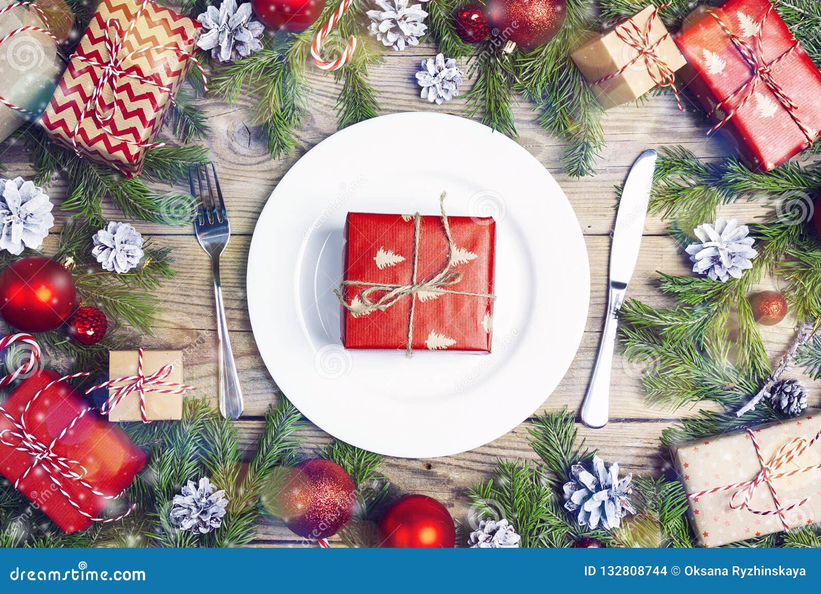 Festive Table Setting with Cutlery, Christmas Decorations and Gi Stock ...