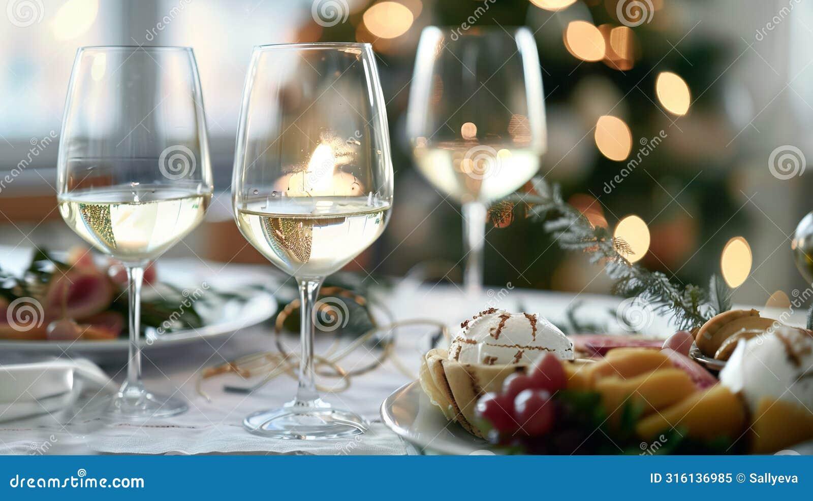 festive table setting, white wine glasses on white table cloth