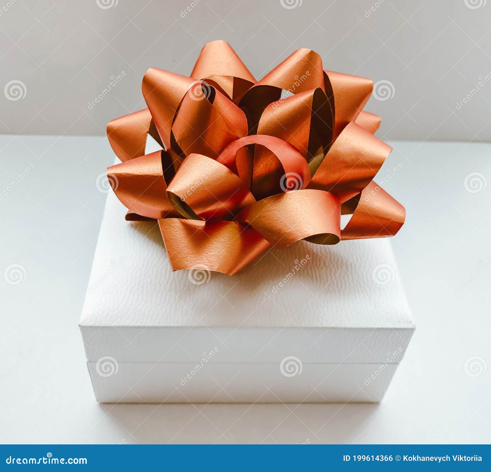 Festive Template with a Beautiful White Gift Box on a White Background