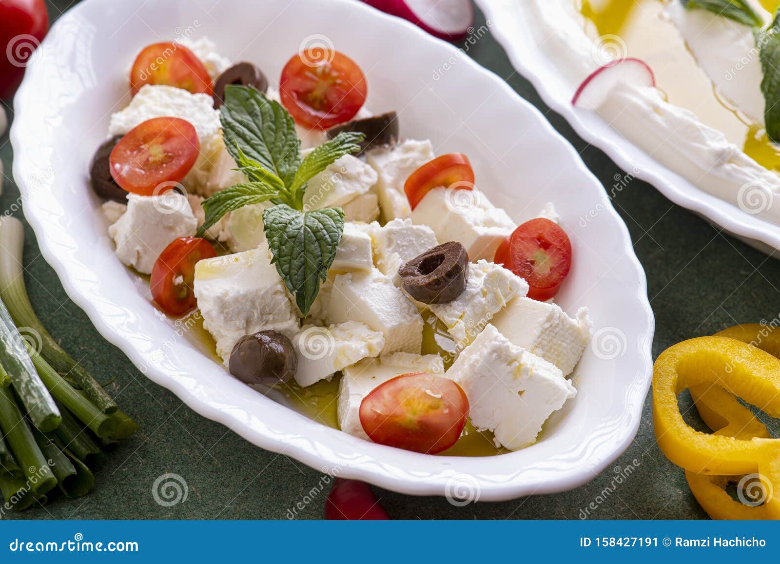 Feta Cheese Cut in Cubes, with Mint, Cherry Tomatoes and Olives Stock