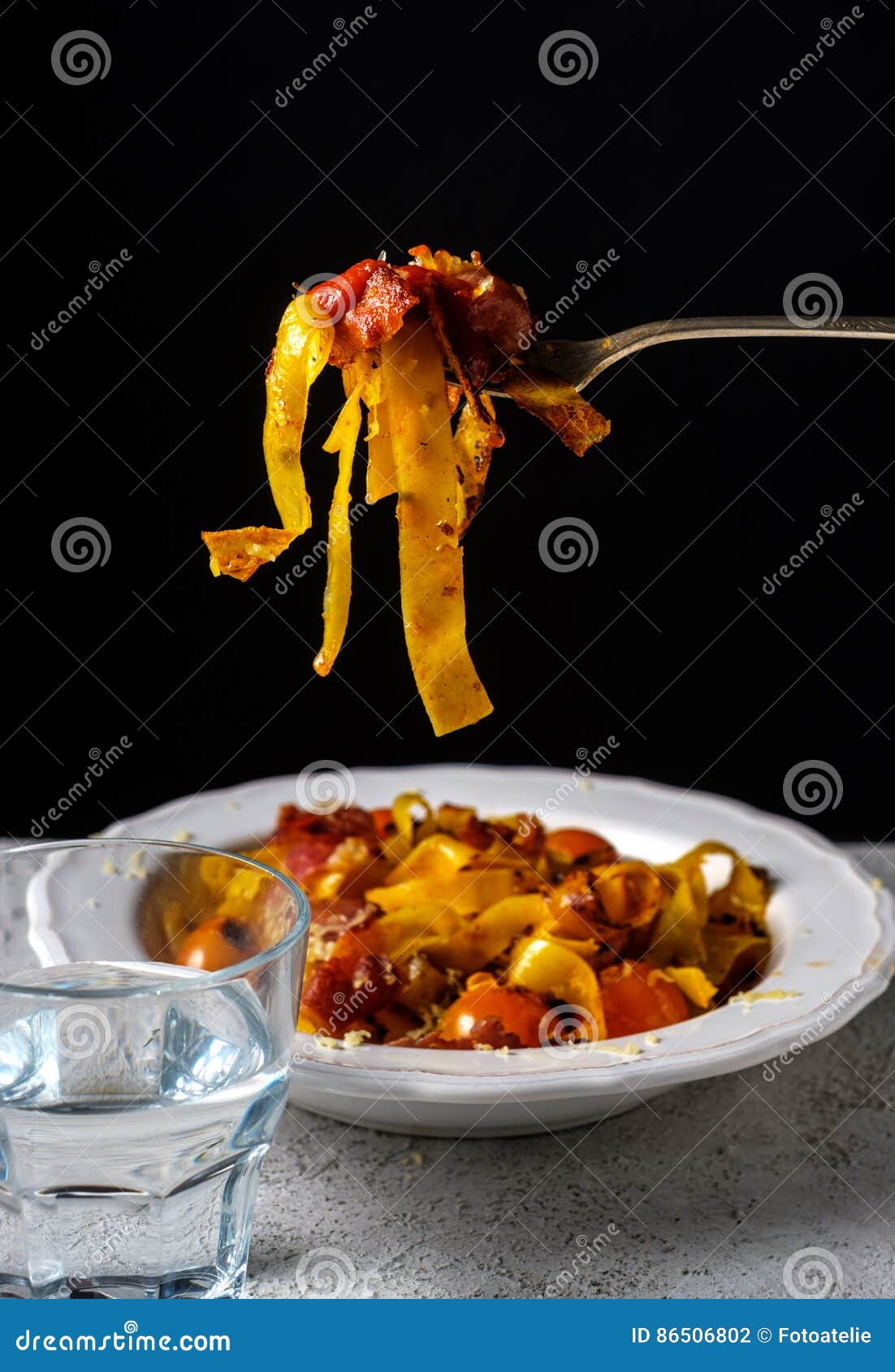 Fettuccine Pasta with Cherry Tomatoes and Bacon. Stock Photo Image of