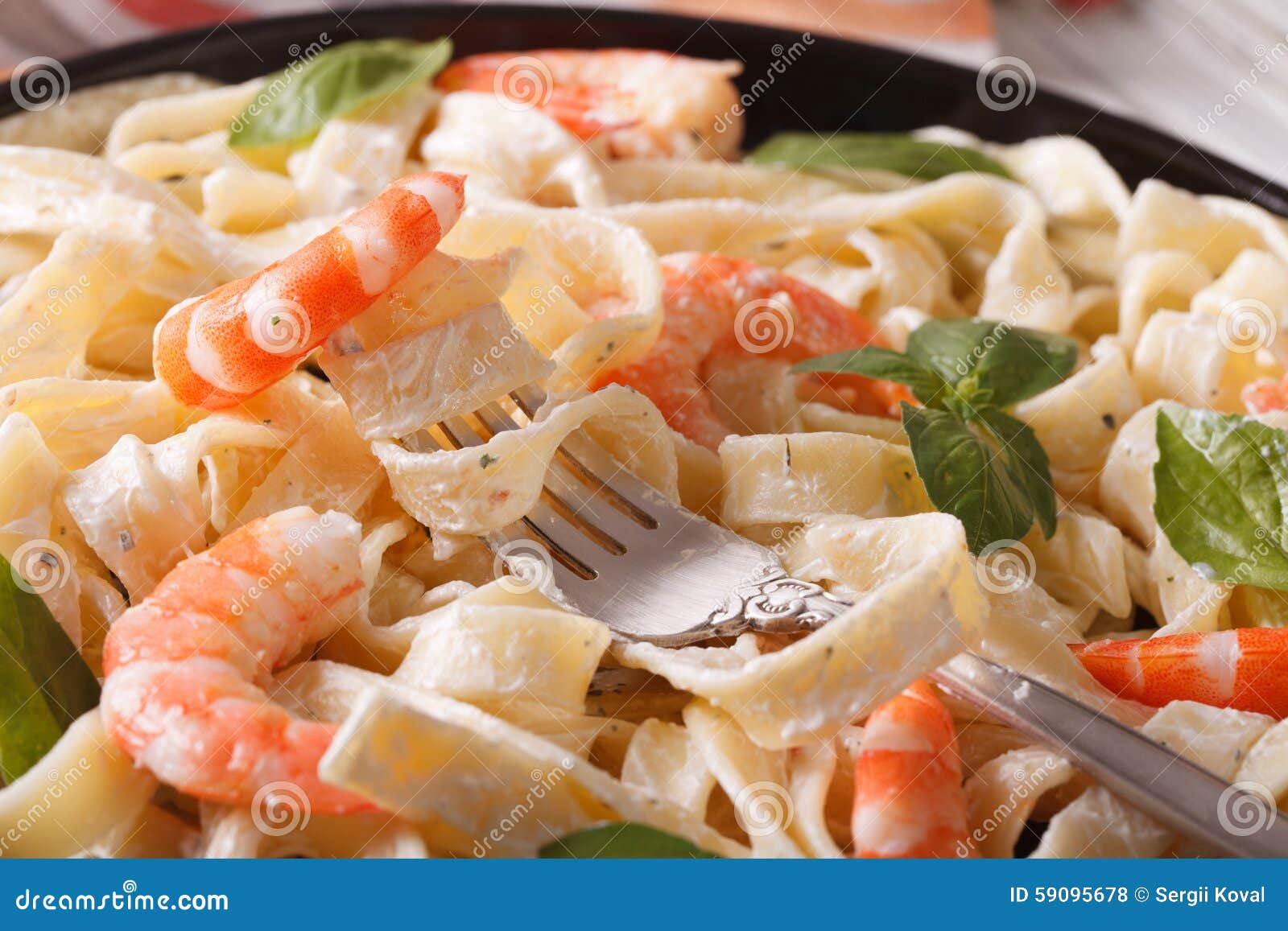 Fettuccini Pasta in Cream Sauce with Shrimp Macro. Horizontal Stock