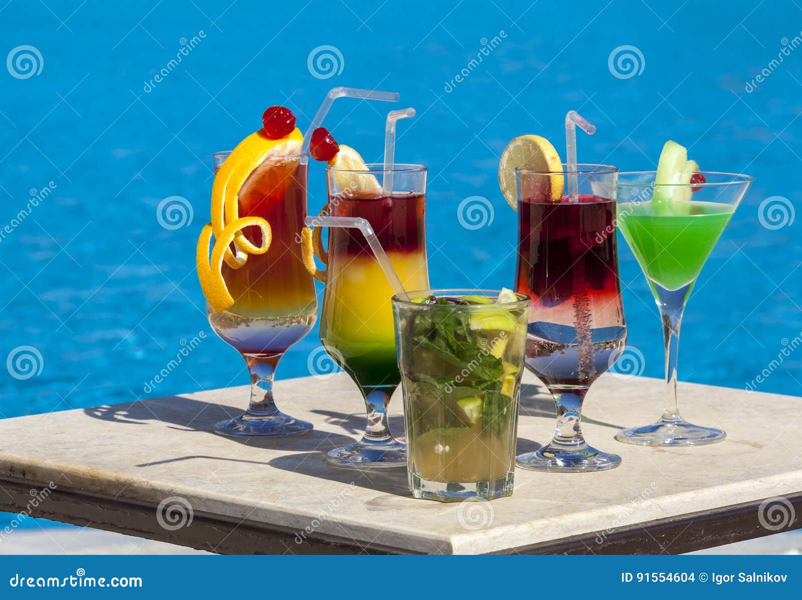 Few Multicolored Cocktails by the Pool Stock Photo Image of party, drink 91554604