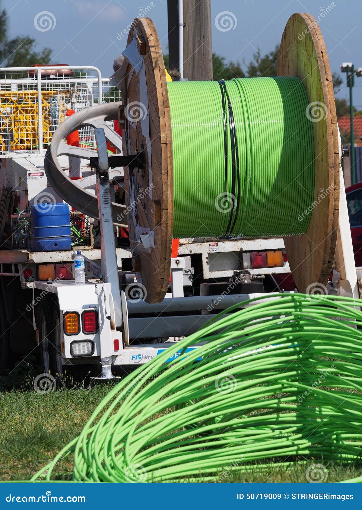 Fiber Optic Cable Piled Up Behind An Installation Truck Stock Image