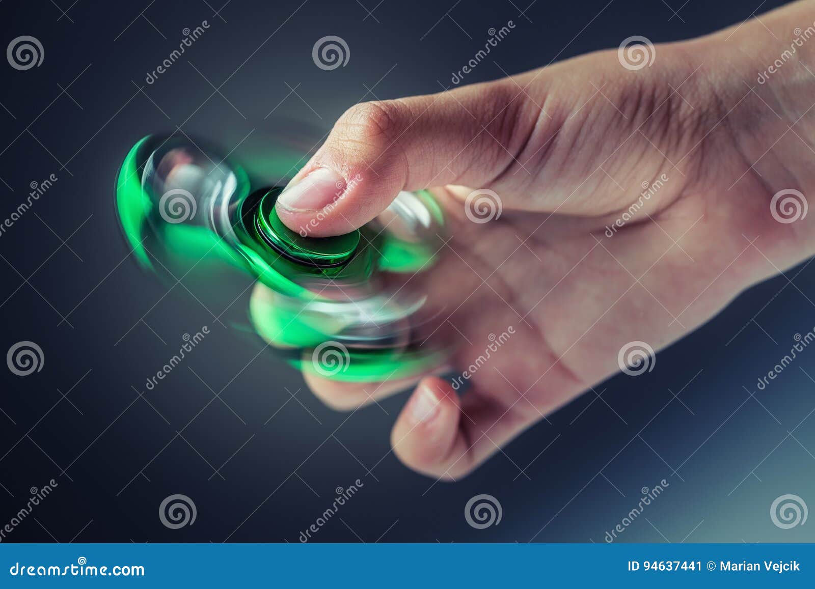 Fidget Spinner. Green Sfidget Pinner in a Girl Hand Stock Image Image