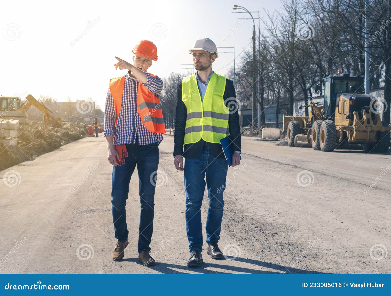 field inspectors at building construction site. land inspector checking a construction site