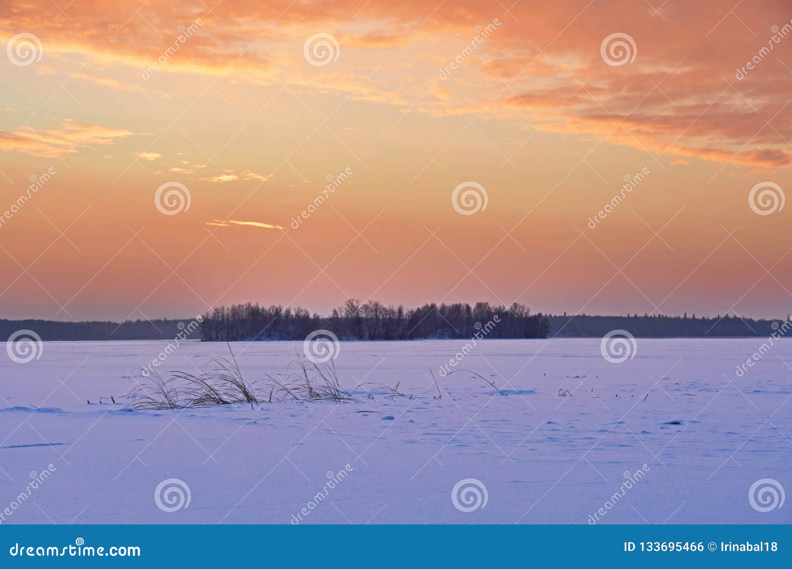 fiery sunrise over lake uvildy in winter, southern ural, chelyabinsk region