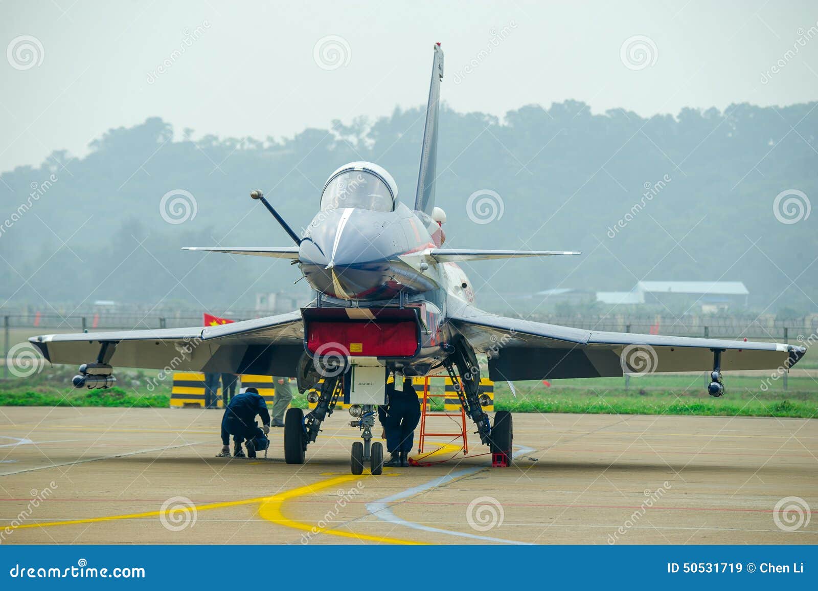 Fighter planes on the tarmac. On the tarmac fighter neatly arranged, doing the preparation before taking off.
