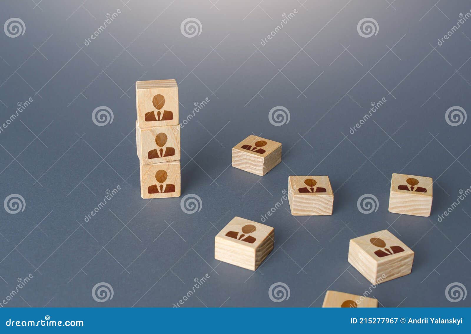 figurine block tower with people. hierarchical system. company organization. hiring, recruiting. team building personnel