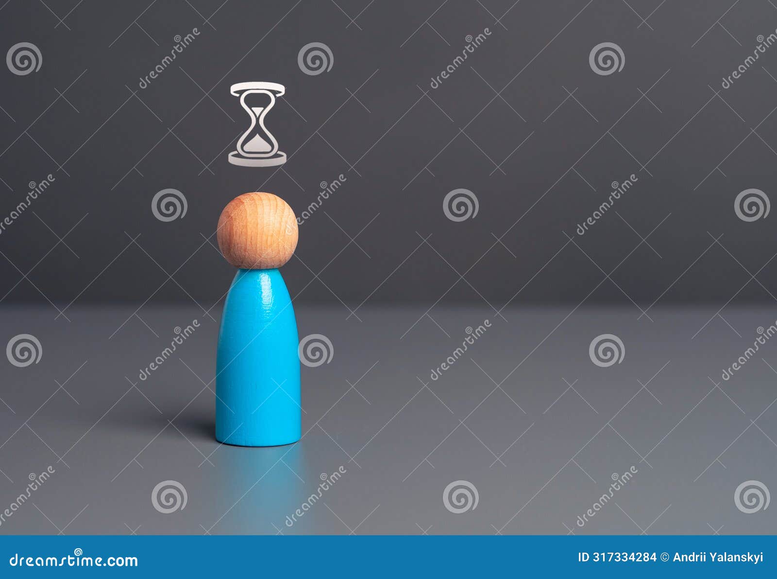 a figurine of a man waiting. hourglass above your head.