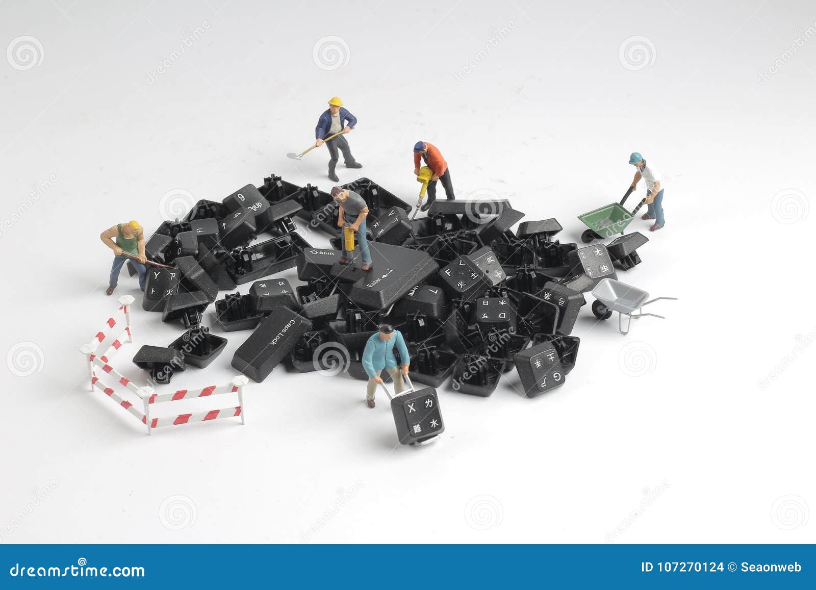 Figurines of Workers Repairing Computer Key Board Stock Photo Image