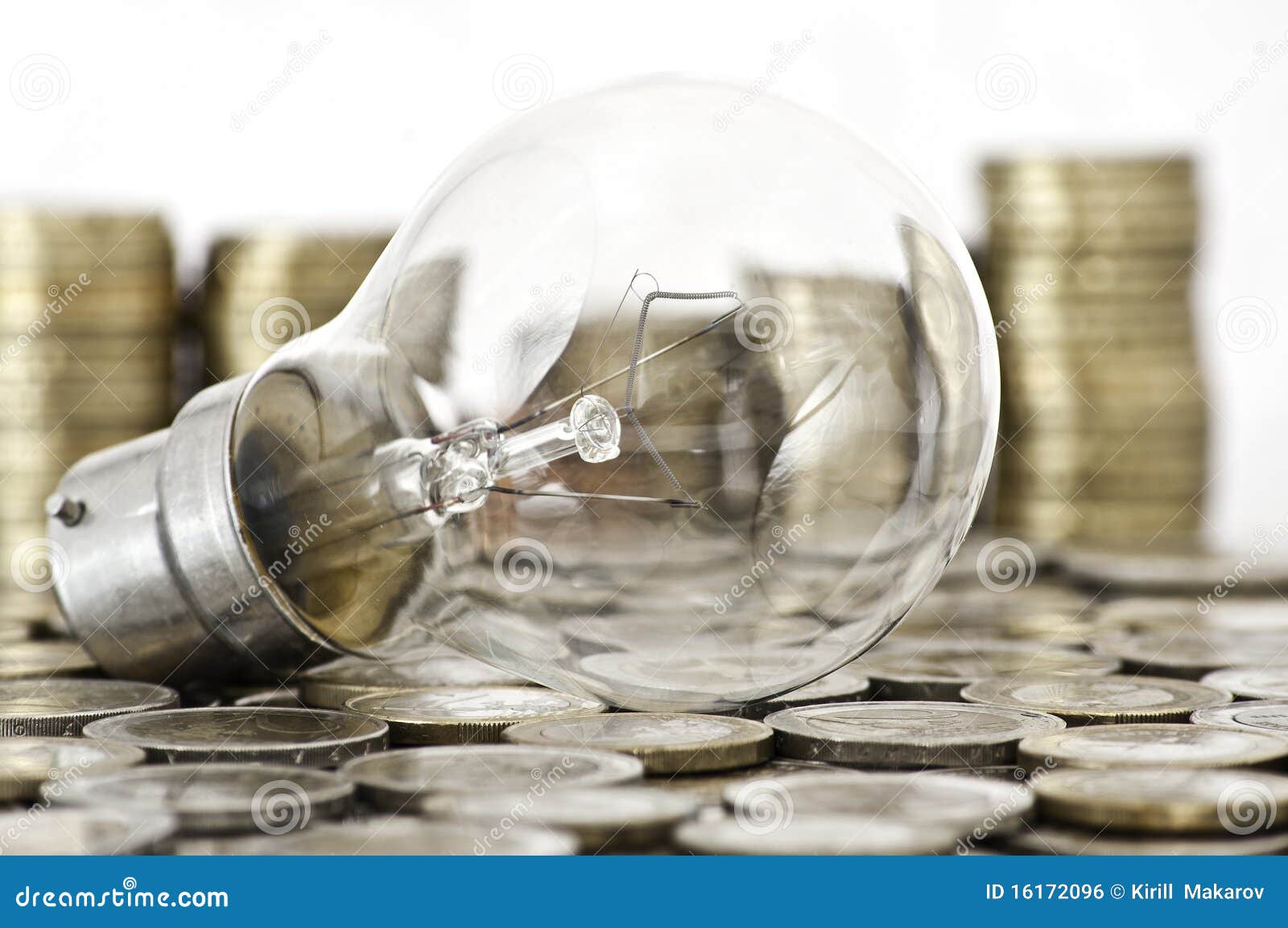 filament bulb lying on coins