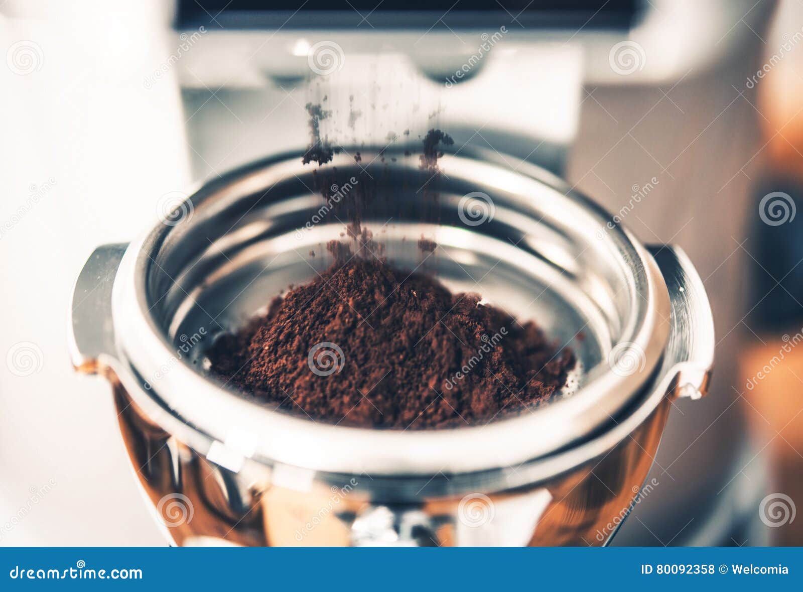 filing portafilter with coffee
