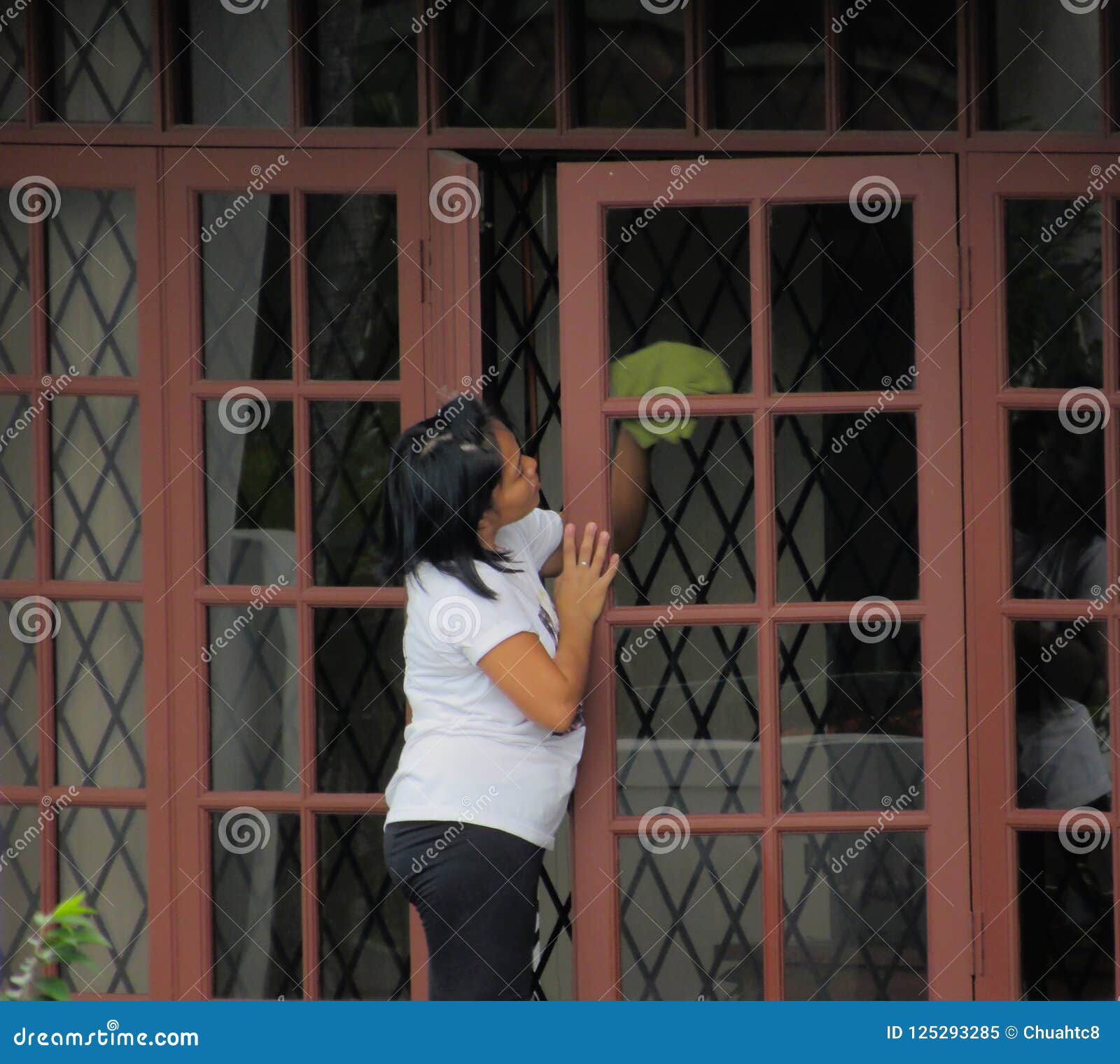 Filipina Maid Cleaning Window Editorial Image Image of window, chores