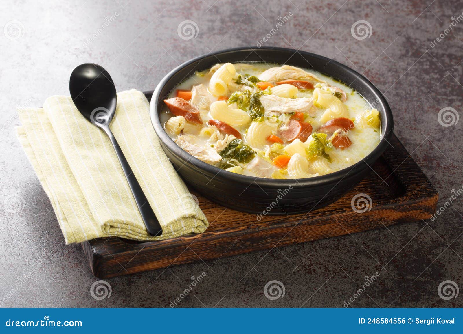 Filipino Chicken Soup with Elbow Pasta, Vegetables, Sausages Close-up