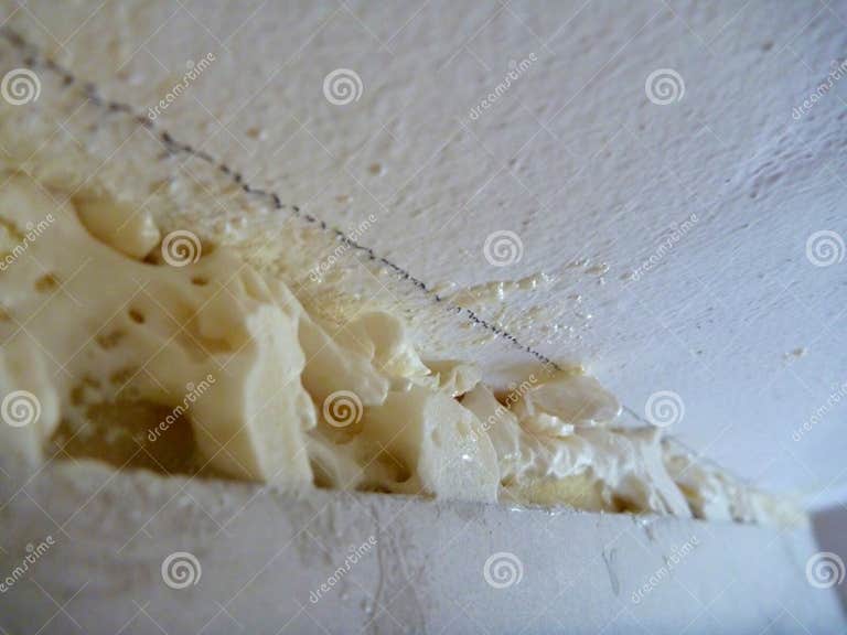 Filling the Gap at Ceiling with Polyurethane Foam Stock Photo Image