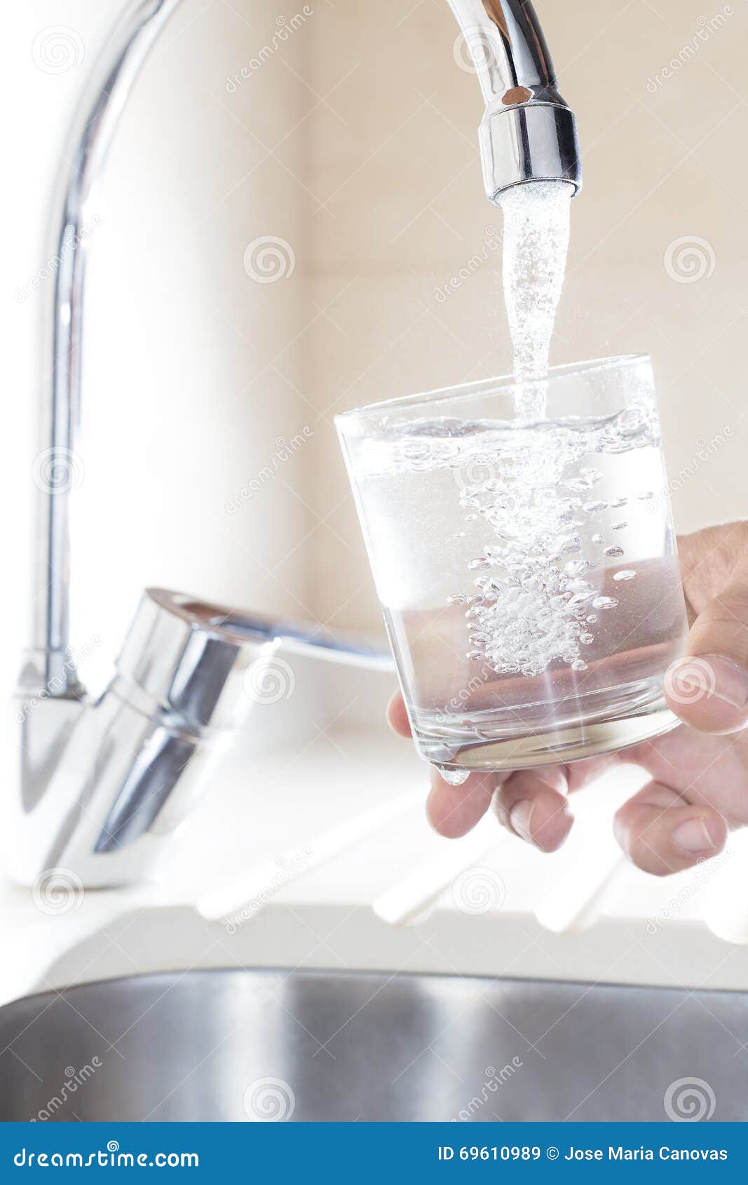 Filling Glass Of Water In Hand From Kitchen Faucet Stock Image