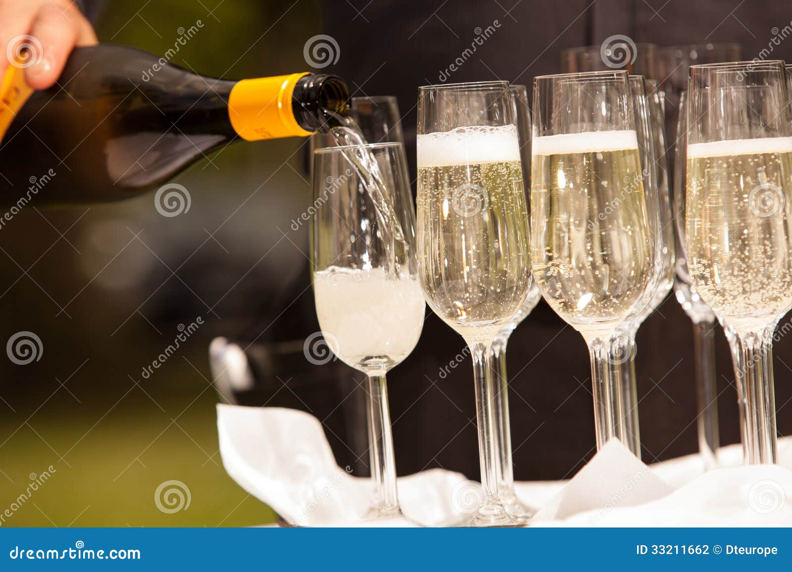 Filling the glasses stock photo. Image of happy, clubbing 33211662