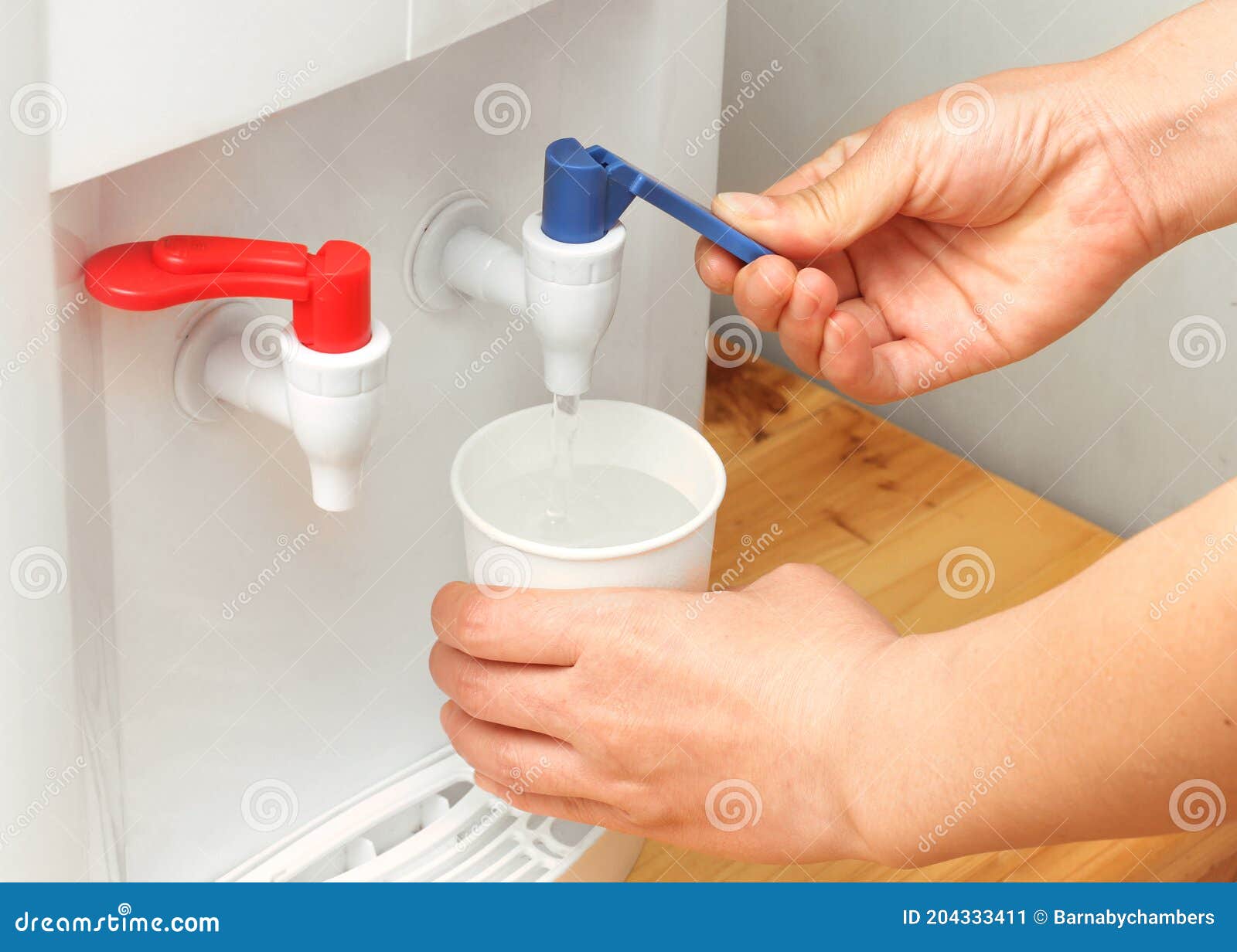 Filling a Paper Cup from a Water Cooler Stock Image Image of vertical