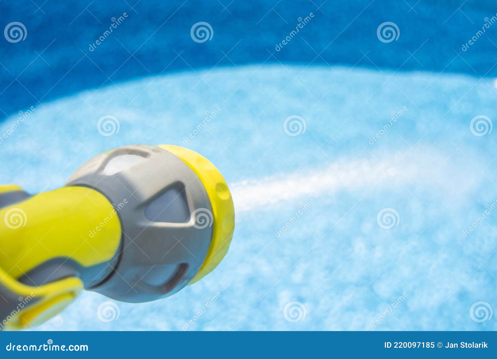 Filling the Water into an Empty Swimming Pool by Garden Hose Stock