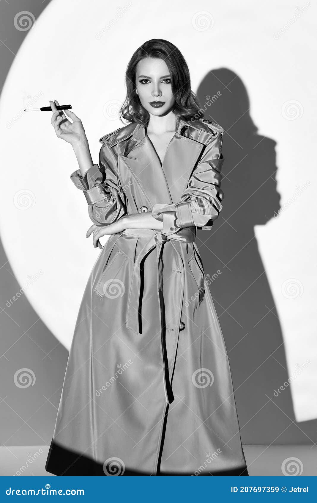 Film Noir Style: Beautiful Elegant Smoking Cigarette. Vintage Retro Portrait of Charming Young Girl in Trench Coat. Black Stock Image - Image of mouthpiece: 207697359