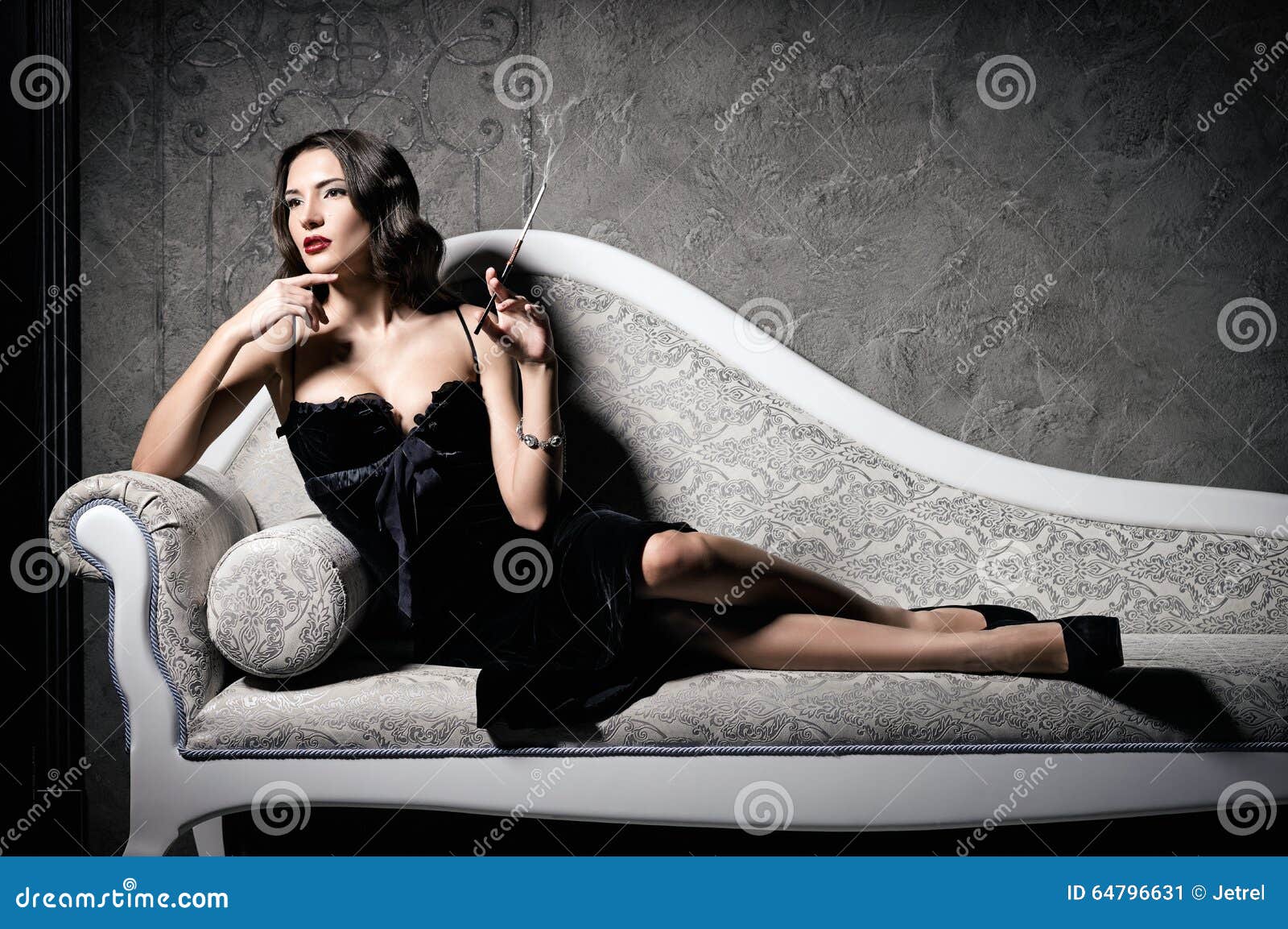 Film Noir Style Gorgeous Beautiful Young Woman Lying On Sofa And